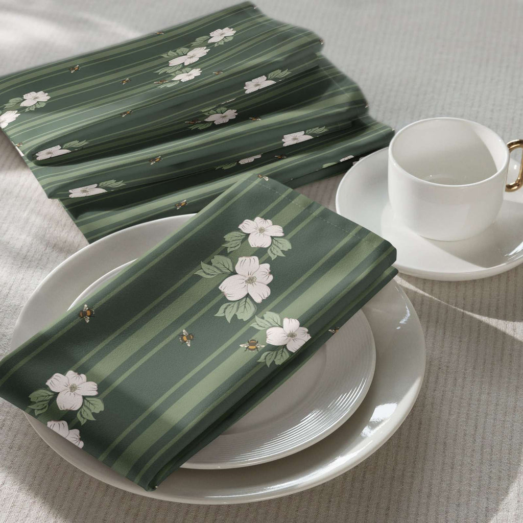 Cloth napkin set in Dogwood & Bee Stripe Evergreen – broadcloth dining linen on a table